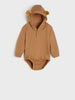 Brown baby onesie with ears on a light gray background