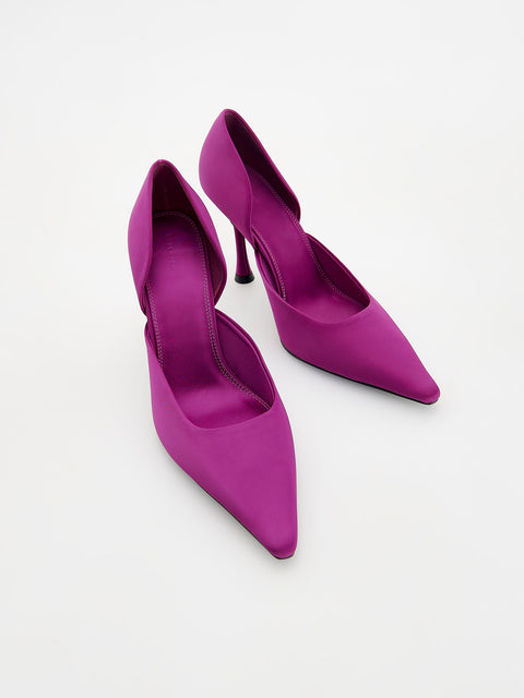 Pair of bright purple high-heeled shoes on a white background