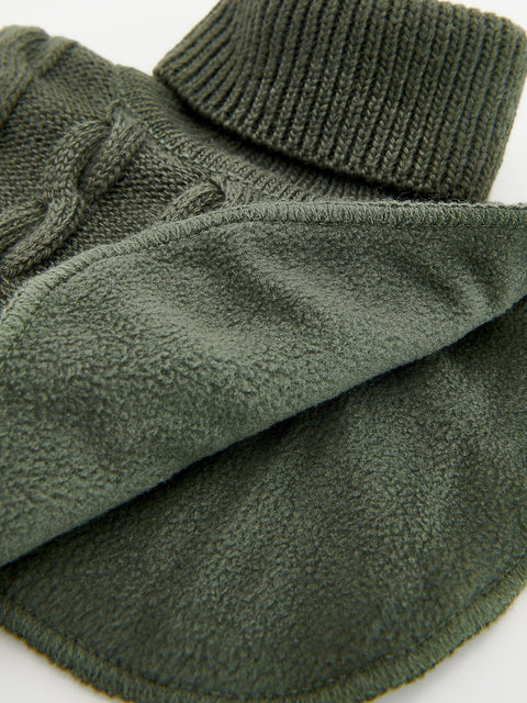 Close-up of green fleece mittens with a textured finish on a white background