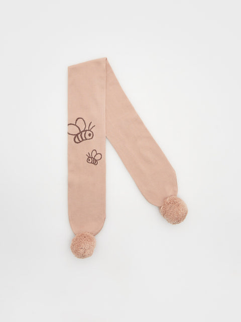 Beige scarf with bee designs and pom-poms on a white background