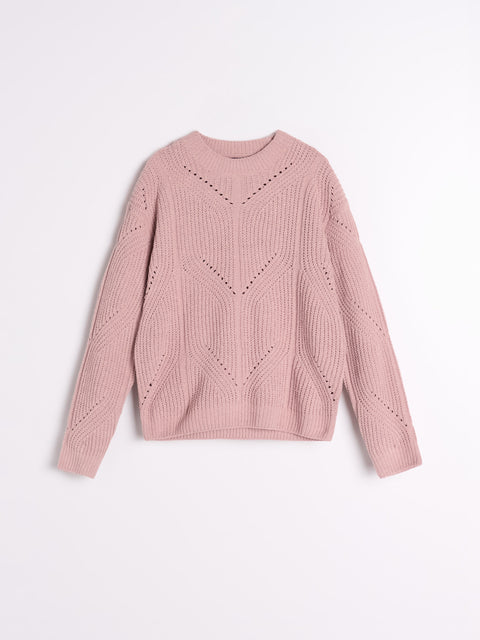 Pink sweater with a geometric pattern on a light pink background