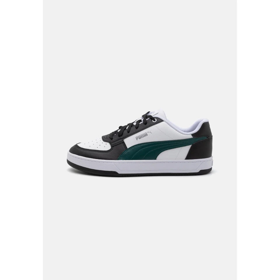 A Puma low-top sneaker in white, black, and dark green, shown from a side profile view against a light gray background.