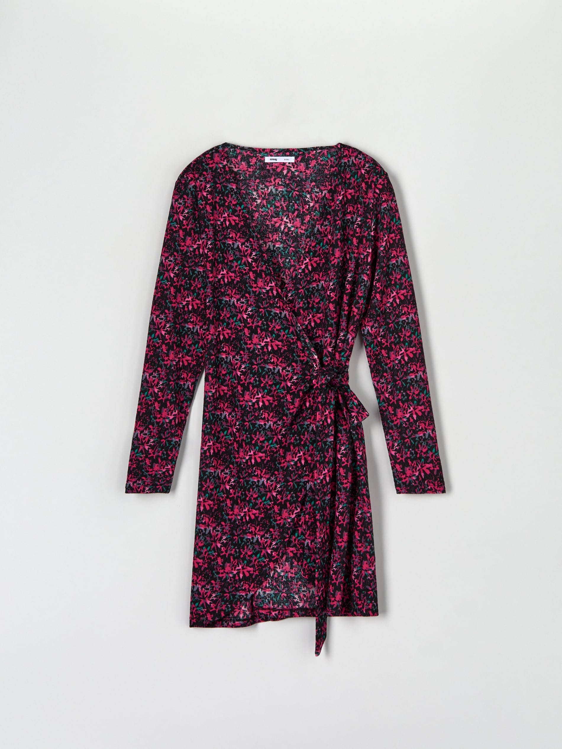 Floral patterned dress with a belt on a light gray background