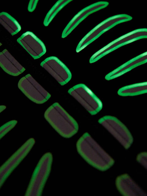 Close-up of a textured surface with green and black patterns