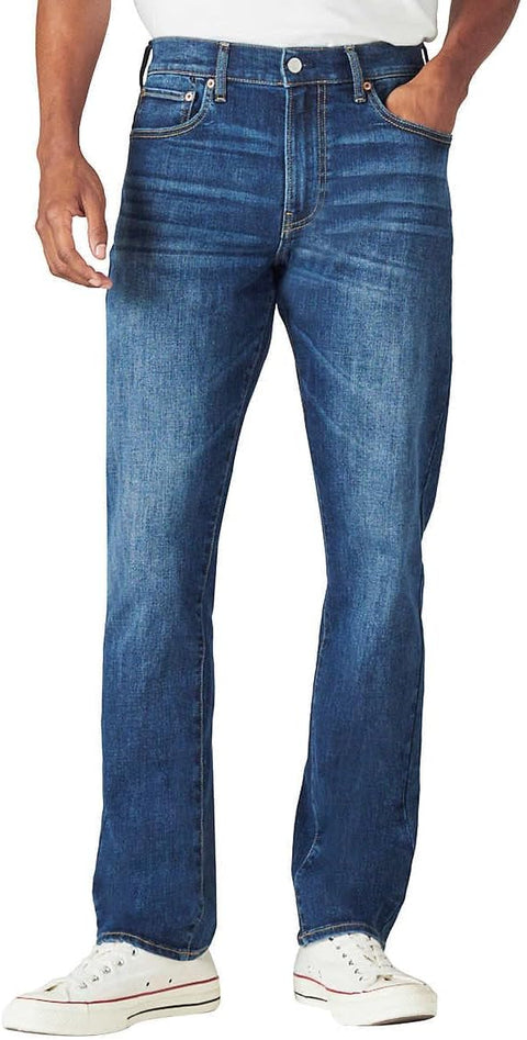 Blue jeans worn by a person on a white background
