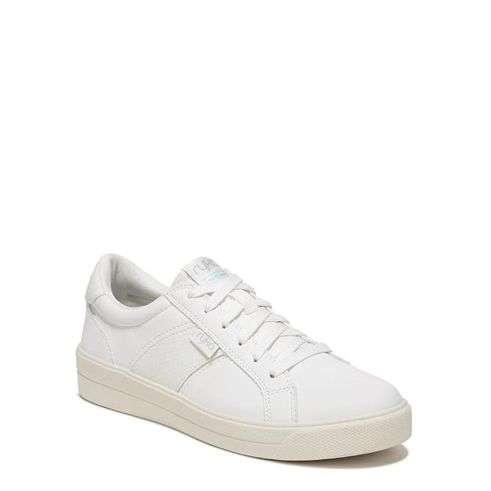 A white leather low-top sneaker with white laces, a white padded collar, and a thick off-white rubber sole, shown from a three-quarters angle on a white background.