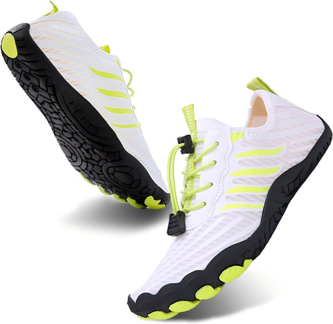 White sneakers with black soles and neon green accents on a white background