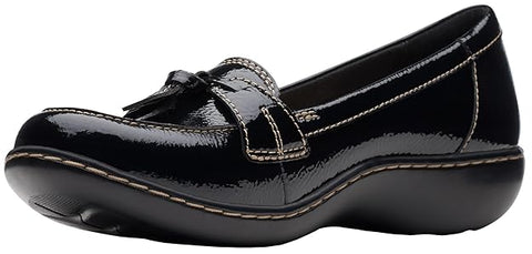 Black patent leather loafer shoe on a white background