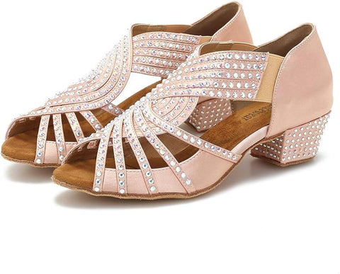 Pink high-heeled shoes with embellishments on a white background