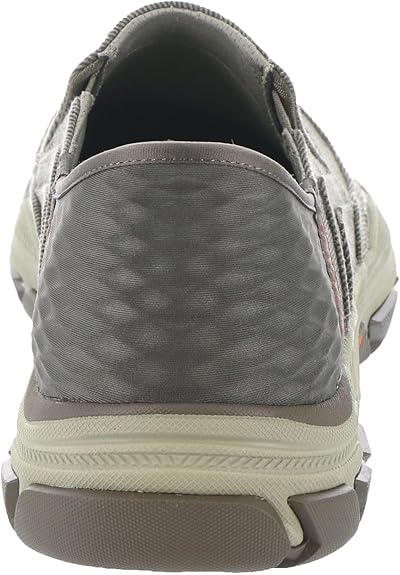 Gray shoe with a focus on the sole and side details on a white background