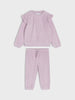 Pink ribbed top and pants set on a white background
