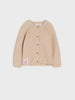 Beige cardigan with button details on a light gray background