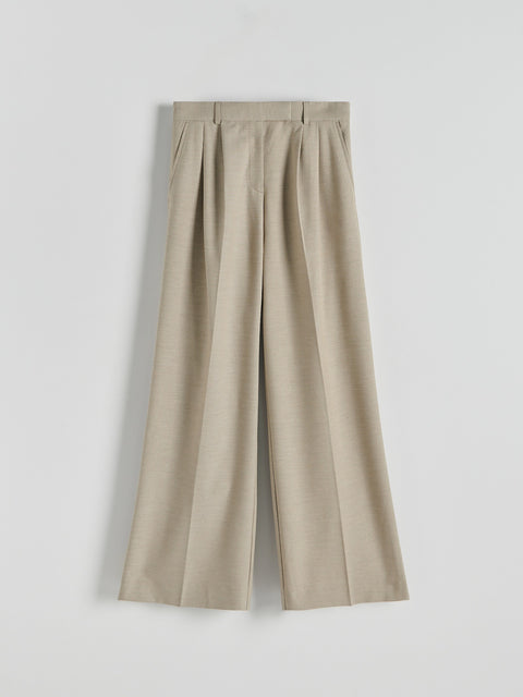 Beige wide-leg pants on a light gray background