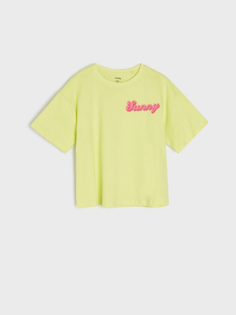 Yellow t-shirt with pink text on a white background
