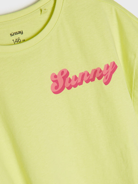 Yellow t-shirt with pink 'Sunny' text and 'Sainsbury's' branding.