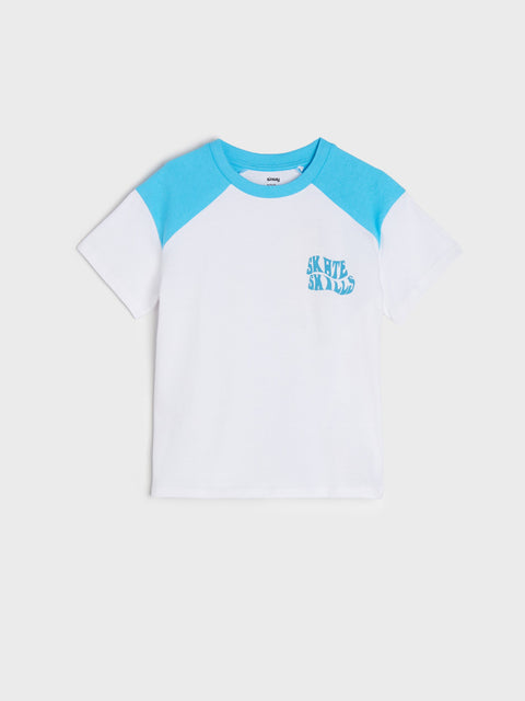 White t-shirt with blue sleeves and logo on a light gray background