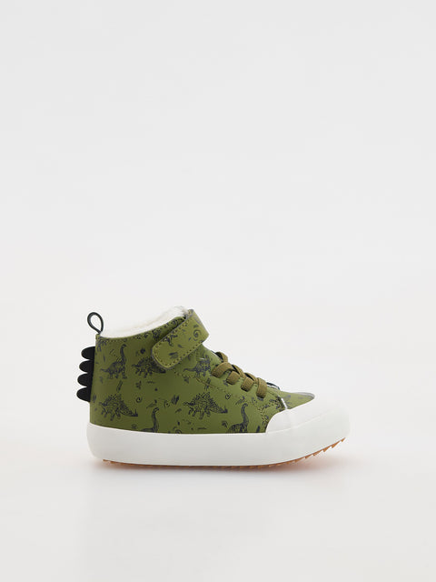 Green high-top sneaker with dinosaur pattern on a white background