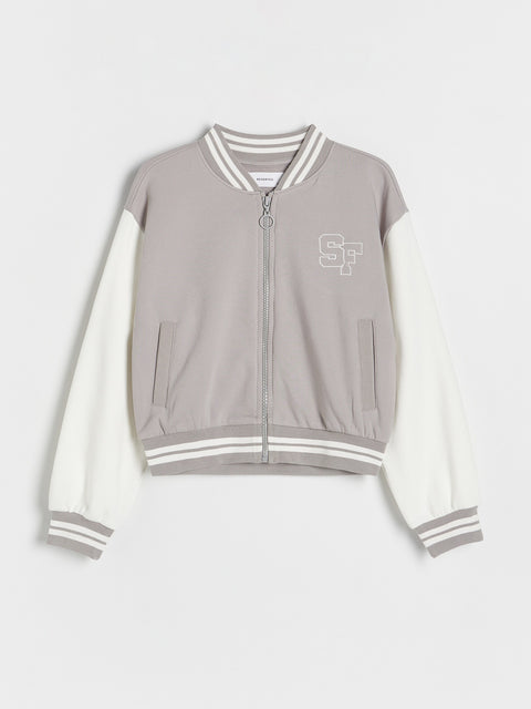 Gray and white jacket with a logo on a light gray background