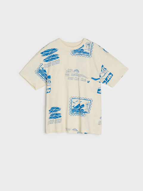 Beige t-shirt with blue graphic designs on a white background
