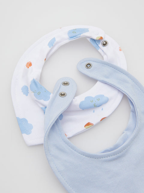 Baby bib and teething ring set with cloud pattern on a light gray background