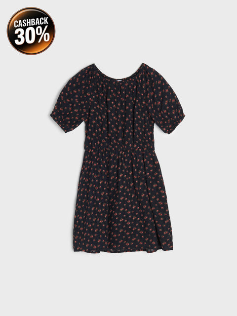 Black dress with small red floral pattern on a light gray background