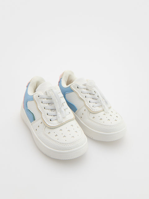 White sneakers with blue accents on a white background