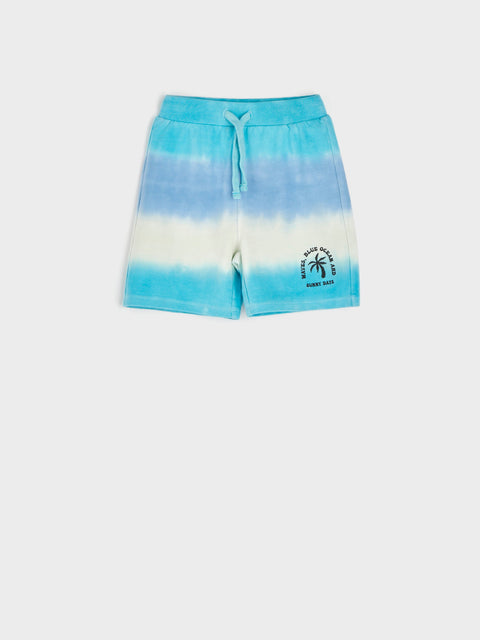 Tie-dye shorts with a palm tree design on a white background