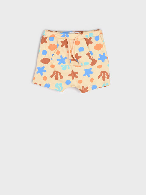 Shorts with colorful star and flower pattern on a light background