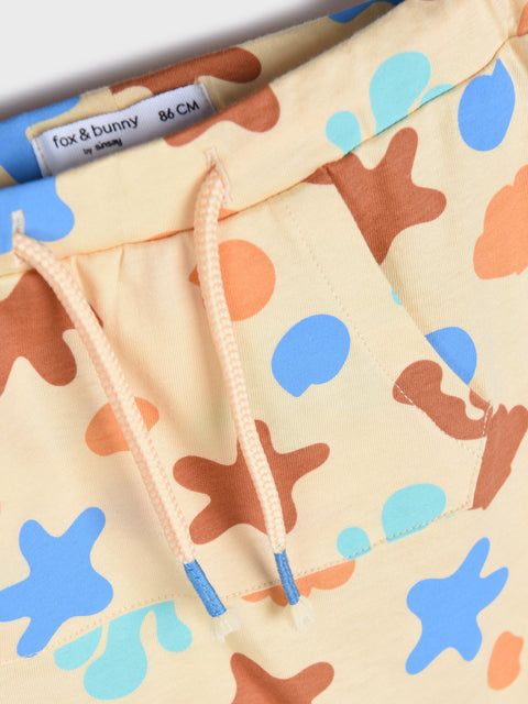 Children's hoodie with starfish pattern on a beige background