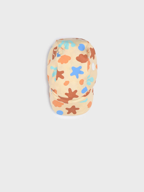 Beige nail with colorful abstract design on a light gray background