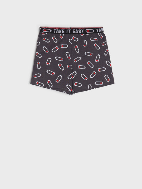 Black boxer briefs with red and white pattern and 'Take It Easy' text on a white background