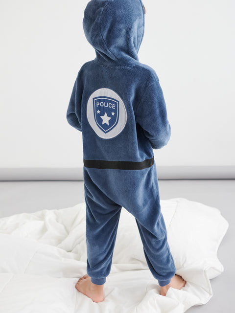 Blue police-themed onesie on a child against a white background