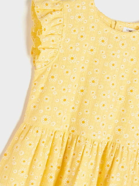 Yellow dress with floral pattern on a white background