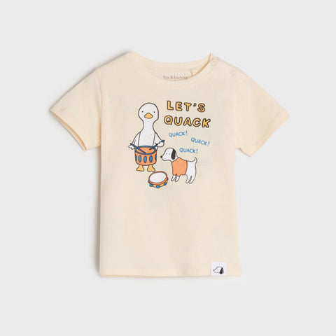 Beige t-shirt with cartoon ducks and text on a white background