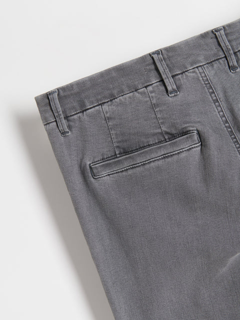 Close-up of gray pants with a pocket on a light gray background