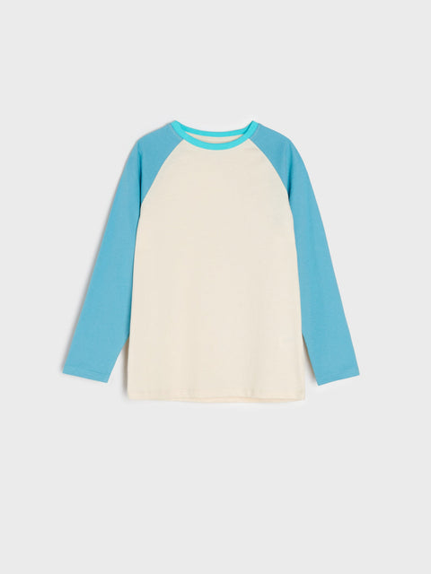 Long-sleeve shirt with blue sleeves and cream body on a light gray background