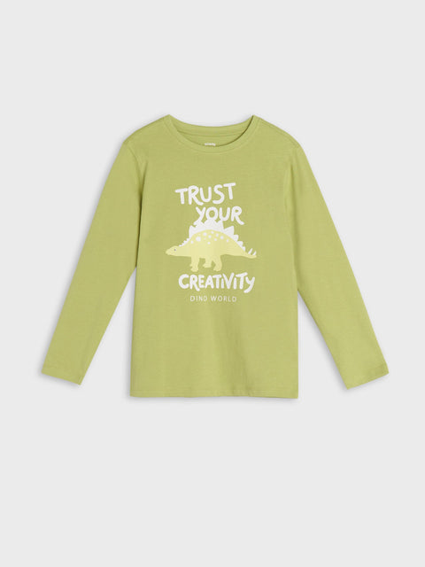 Green long-sleeve shirt with dinosaur graphic and text on a white background