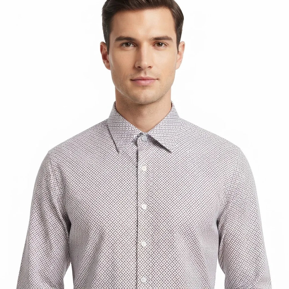 A man wearing a light gray and white micro-patterned button-down shirt, shown from the chest up against a plain white background.