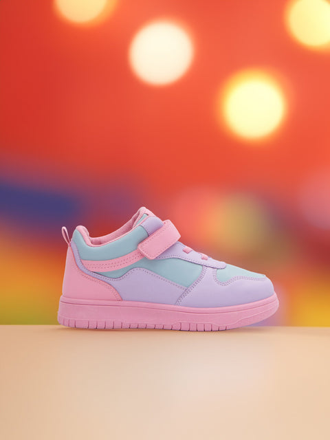 Pastel pink and light blue sneaker on a colorful blurred background