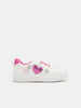 White sneaker with pink heart and star designs on a white background