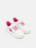 White sneakers with pink accents on a white background