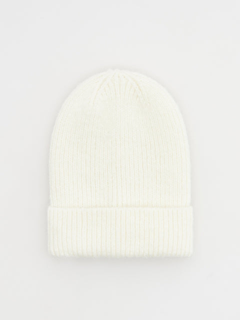 White knit beanie on a light gray background