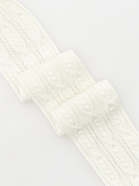 Close-up of a white knitted headband on a light gray background