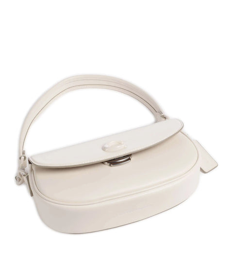 White handbag with a curved design on a white background