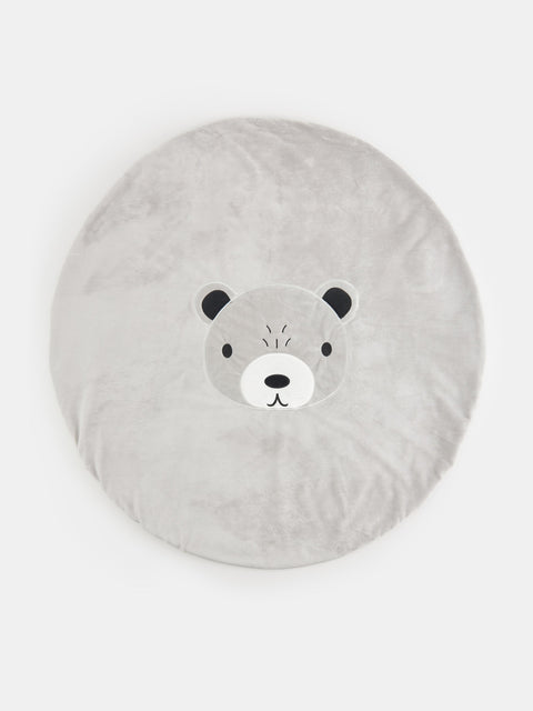 Round gray cushion with a bear face design on a white background