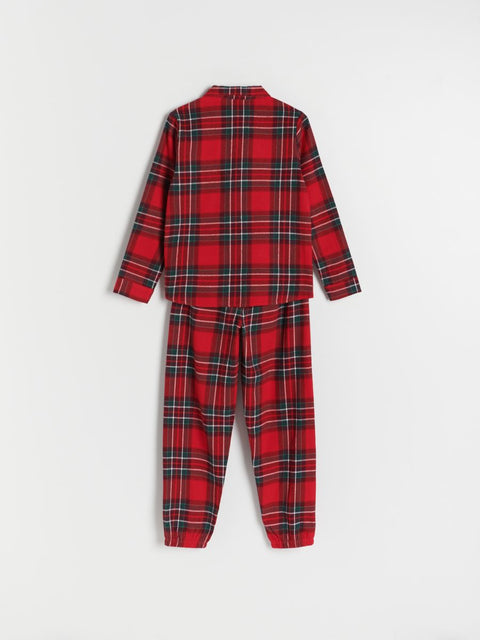 Red plaid onesie on a white background