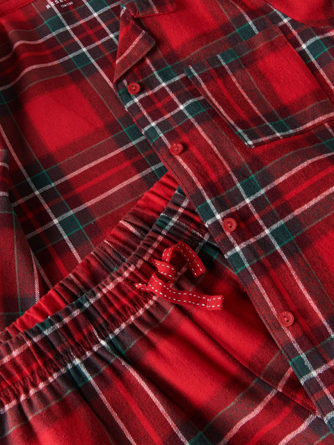 Close-up of a red plaid shirt with buttons