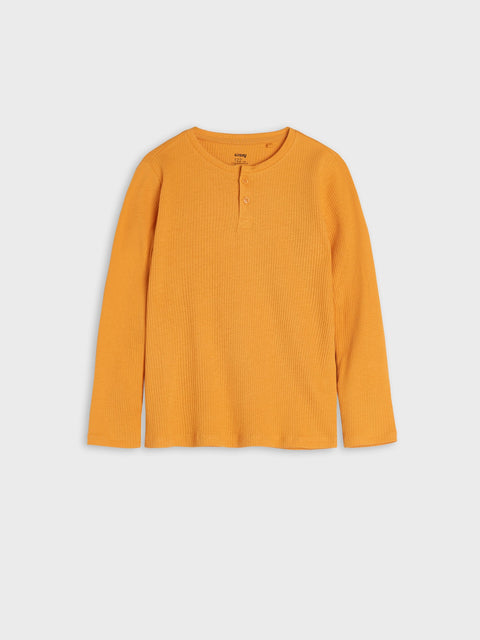 Yellow long-sleeve shirt on a light gray background