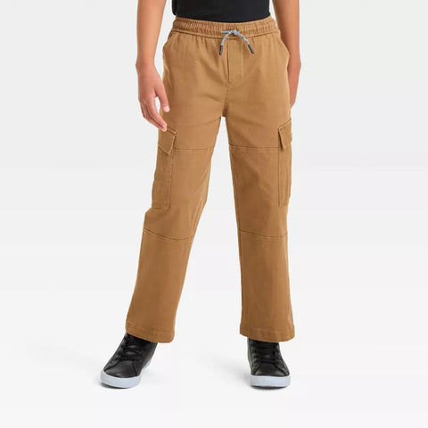 Person wearing tan cargo pants on a white background