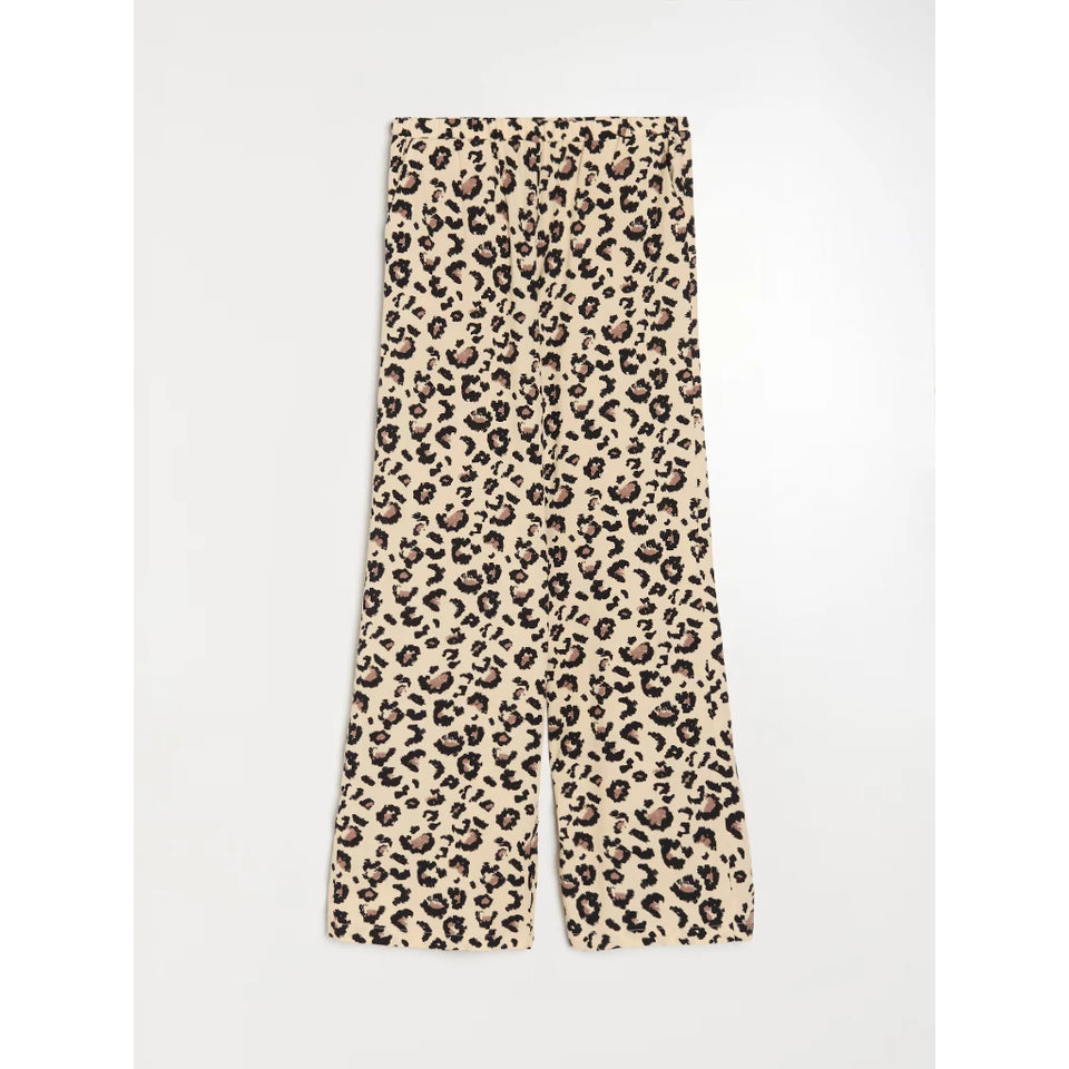 Wide-leg trousers featuring a beige, brown, and black leopard print pattern, laid flat against a light gray background.